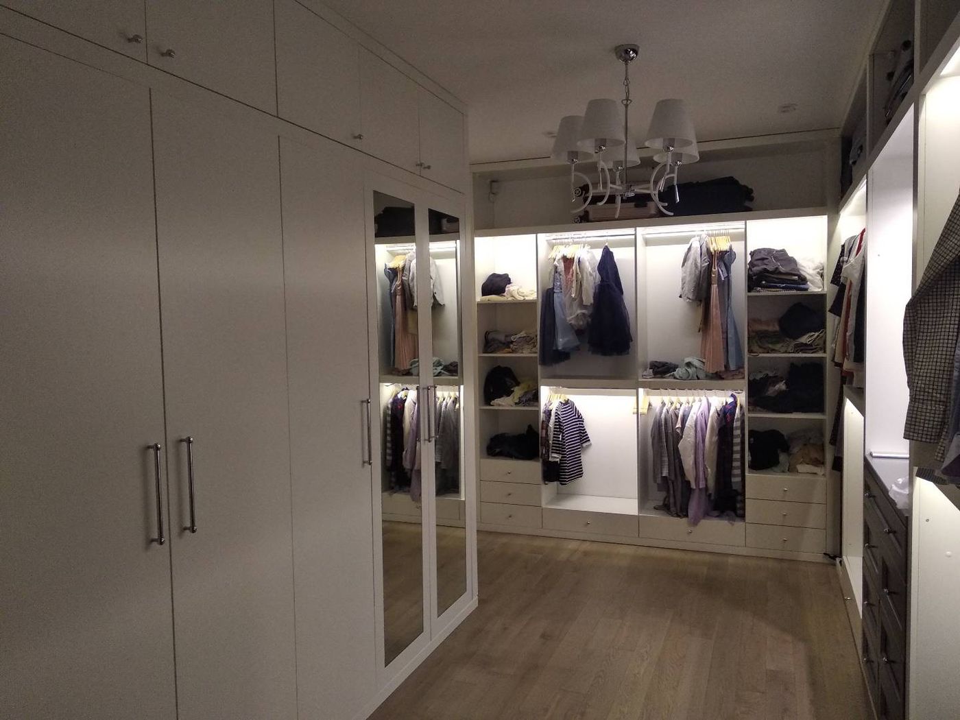 Walk-in closet with LED-lit sections