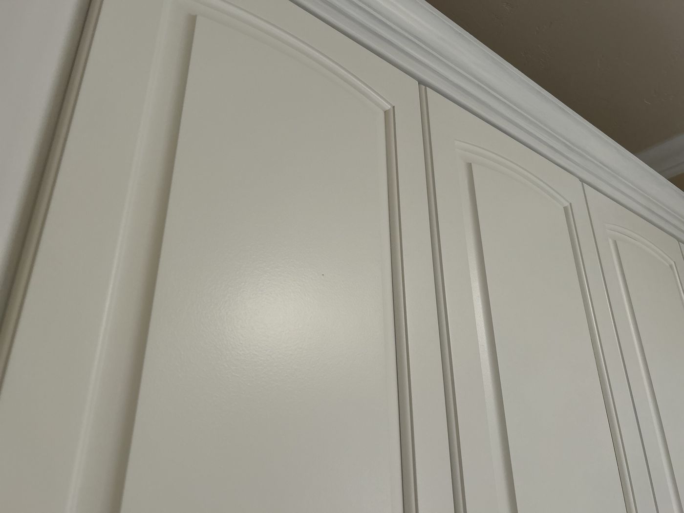 Arched-panel cabinets, refinished